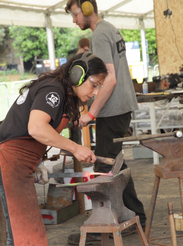 British blacksmith working in a studio
