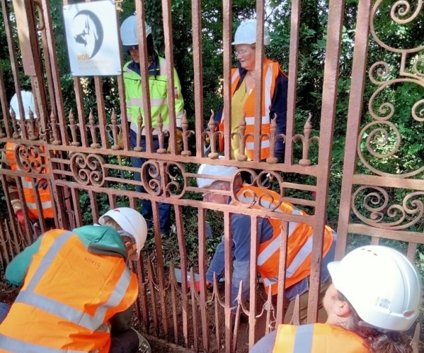 Handcrafted metal gate being assembled